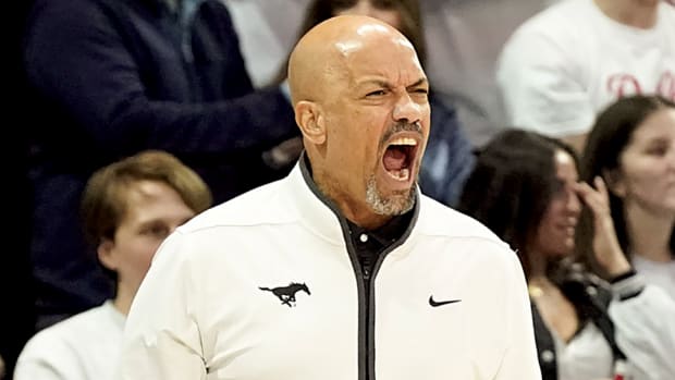 SMU Mustangs head coach Rob Lanier yells from the bench against the Houston Cougars during the first half at Moody Coliseum.